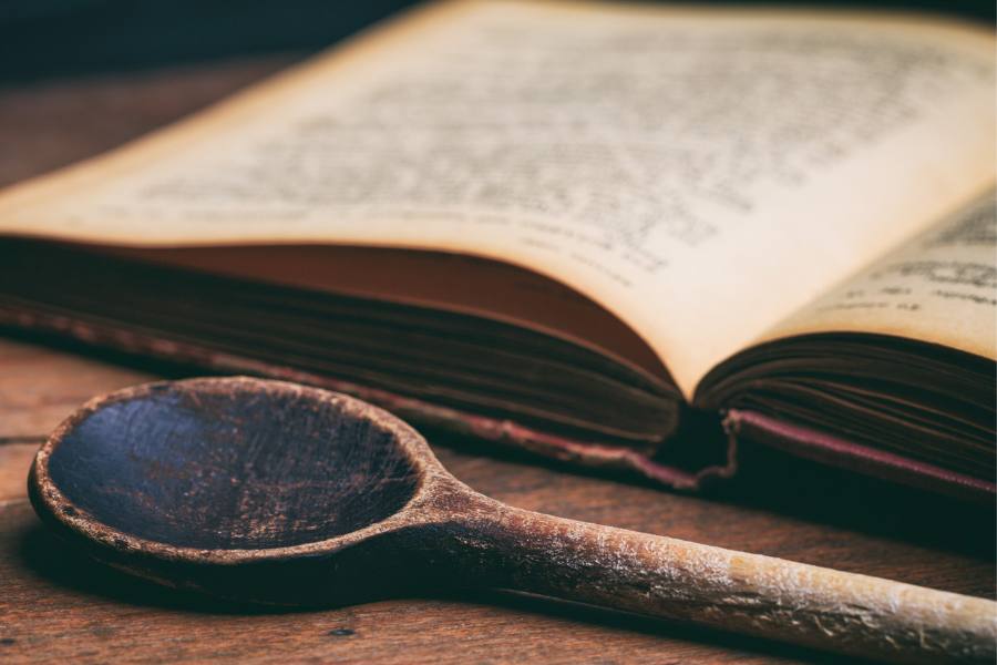 vintage cookbook and wooden spoon