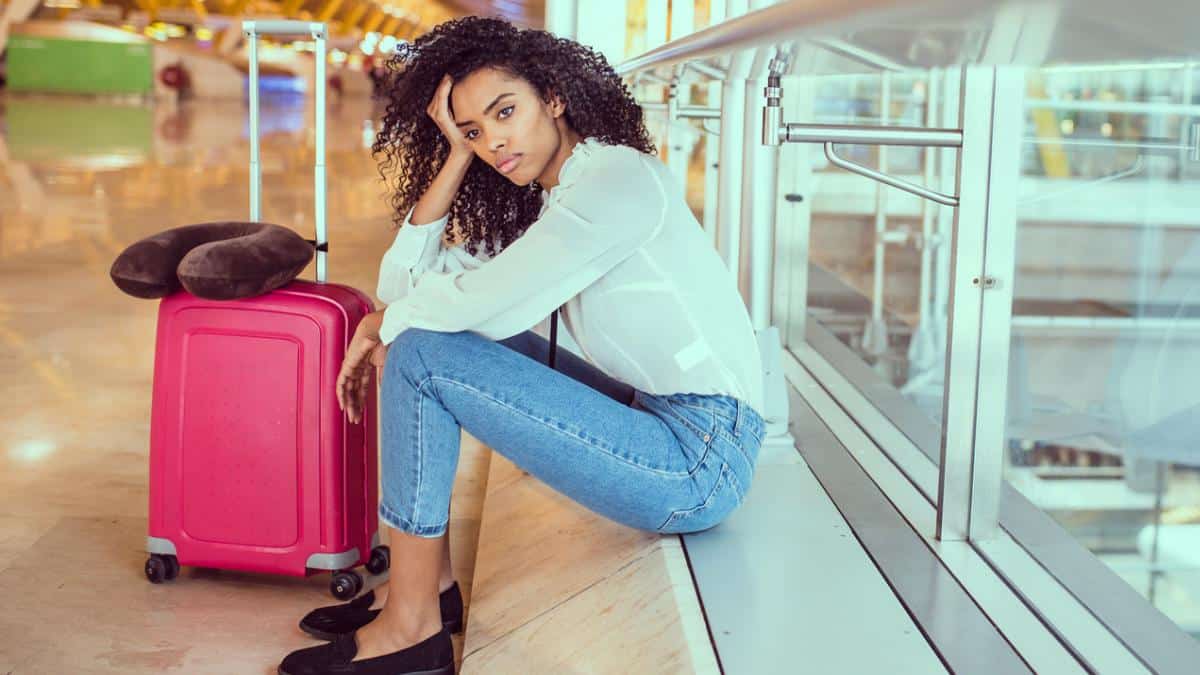 sad woman at airport