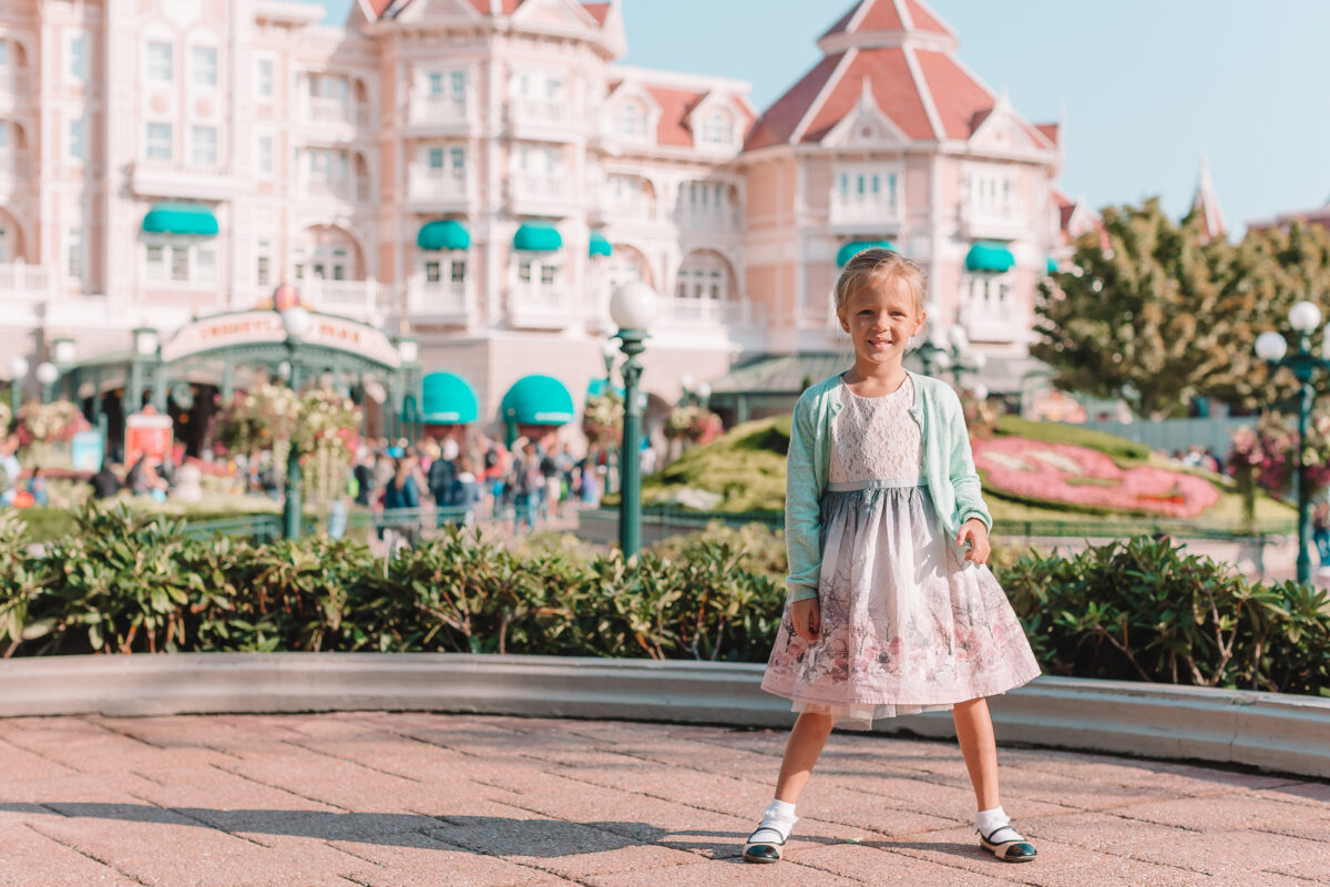 Little happy girl in Disneyland