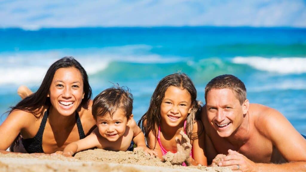 family of four on beach