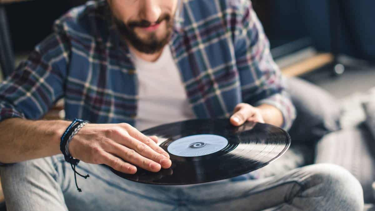 man with vinyl record