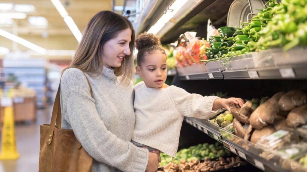 mom and daughter grocery shopping