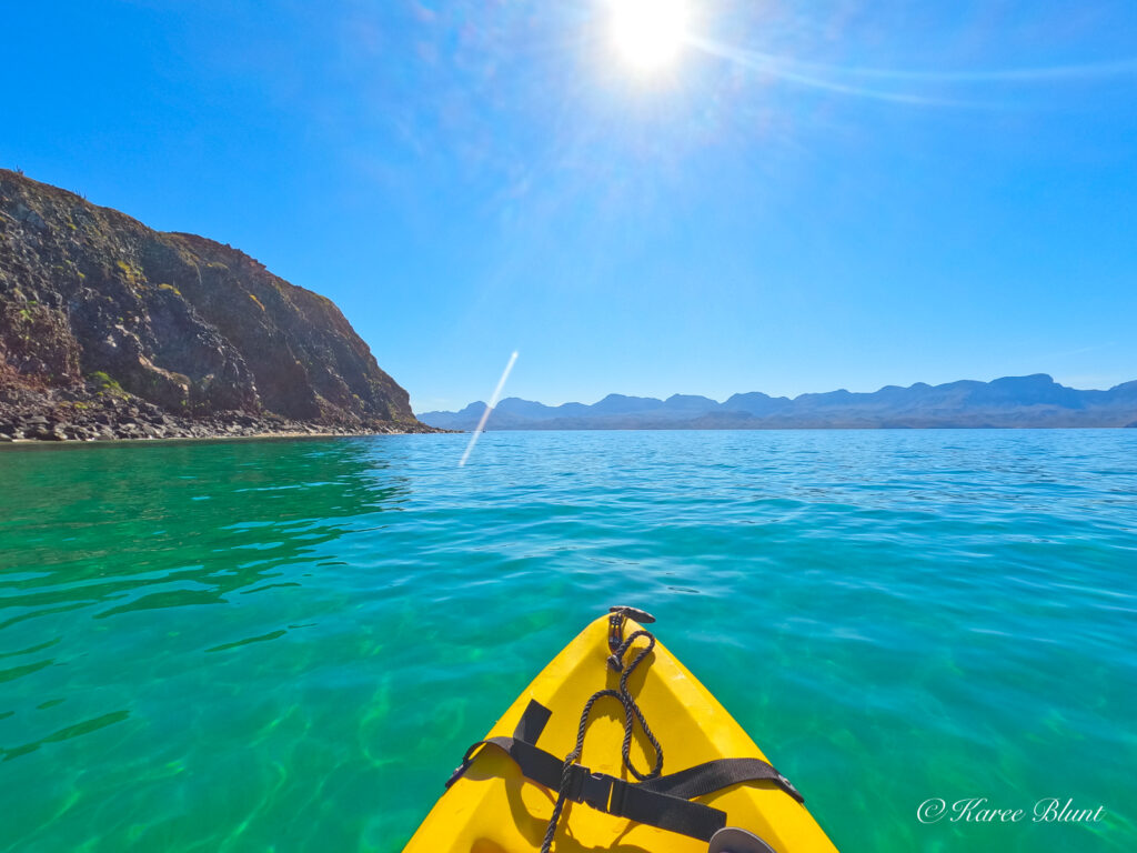kayaking on green ocean water