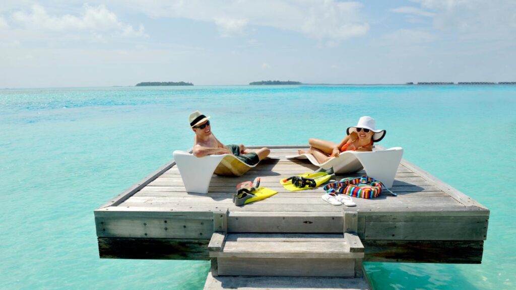 man and woman in Maldives over water