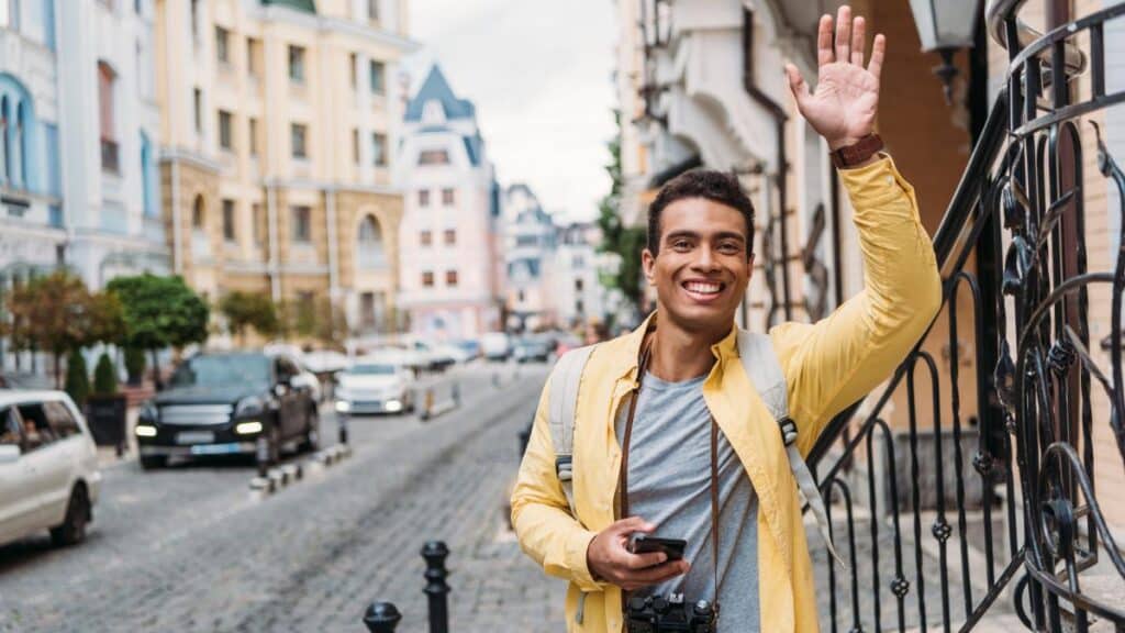 man tourist waving yellow jacket