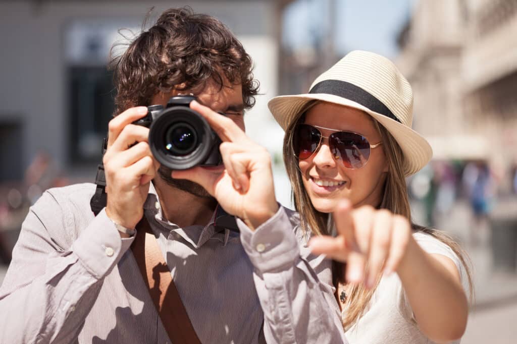 Tourists photographing and having fun in a city