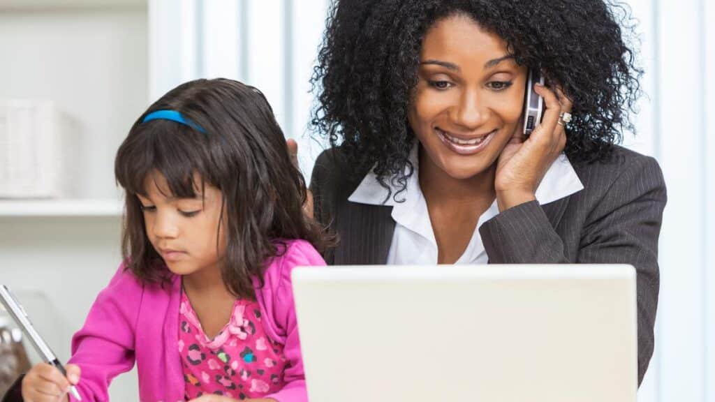 mom working with child in lap - DP