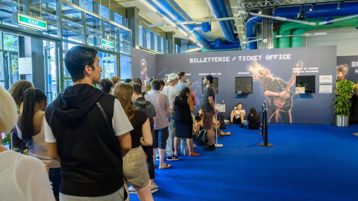 tourists buying tickets