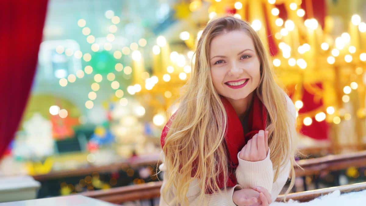 woman smiling with glittery lights