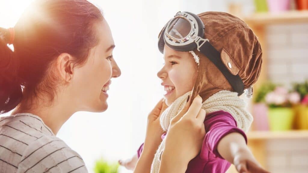 young mom and daughter playing