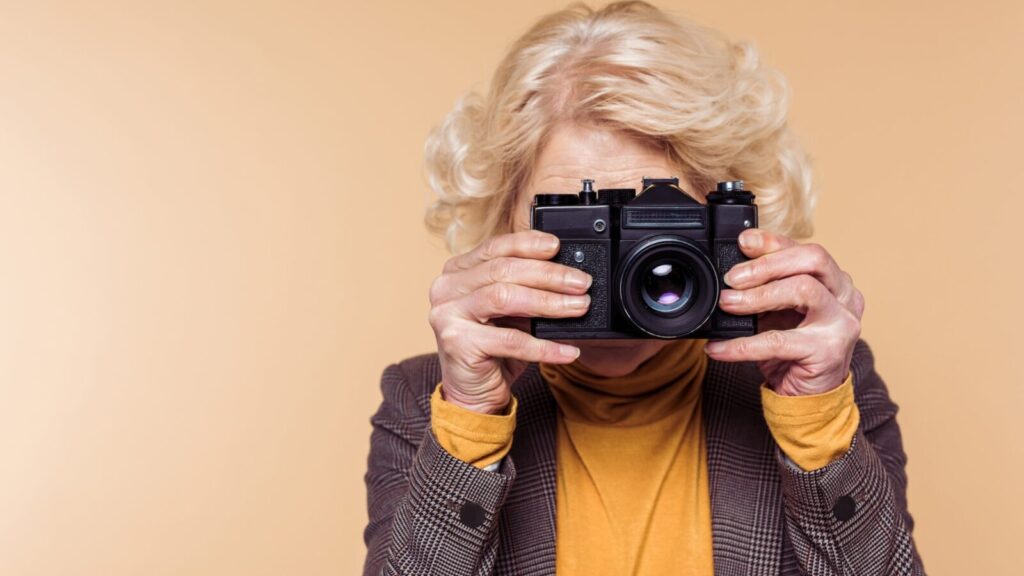 older woman taking photo