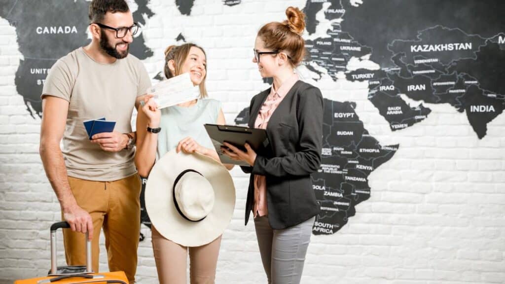 man and woman tourists with travel agent