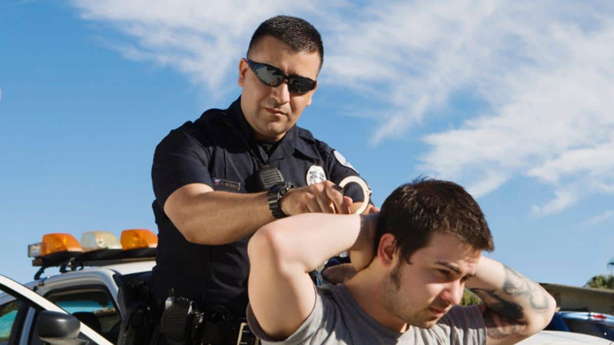 police arresting man