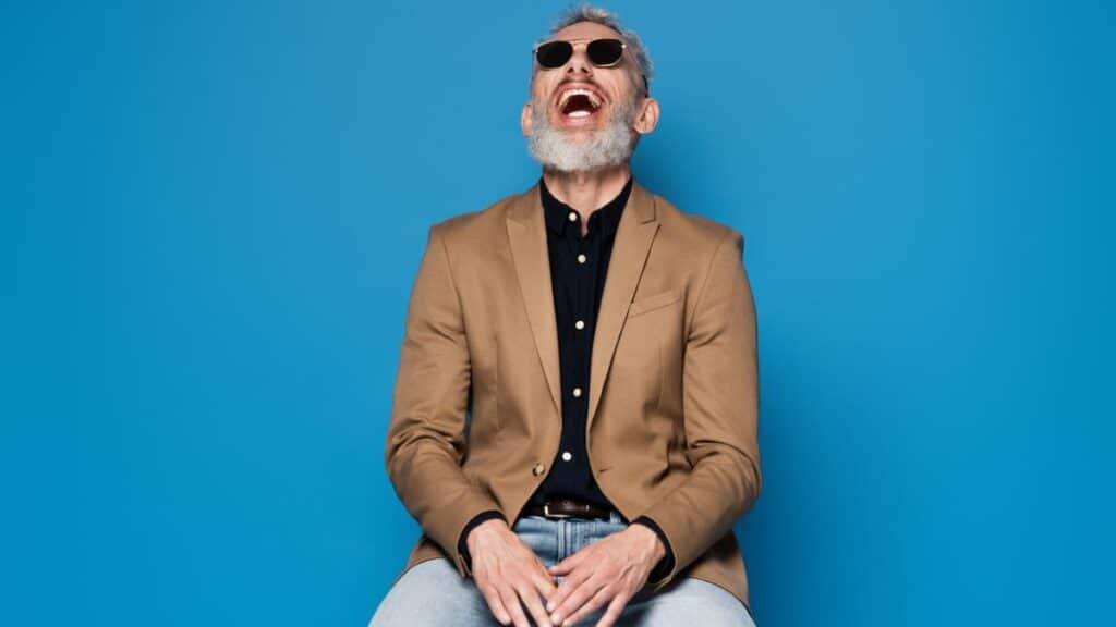 cool dad laughing sitting on stool
