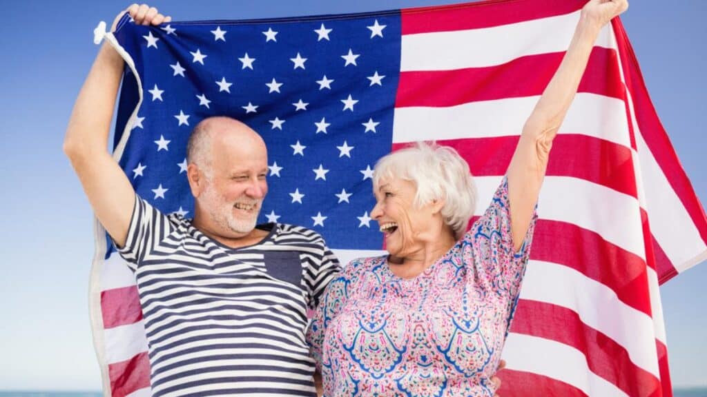 older man and women with flag