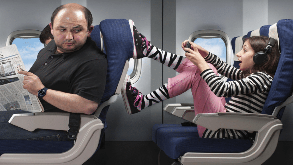 young girl annoying the passenger