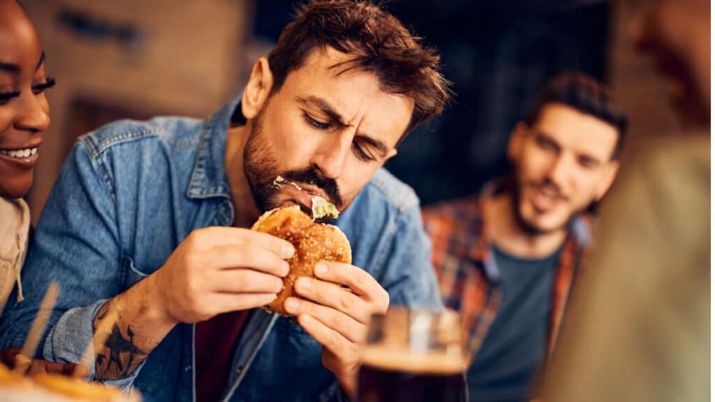 man eating food