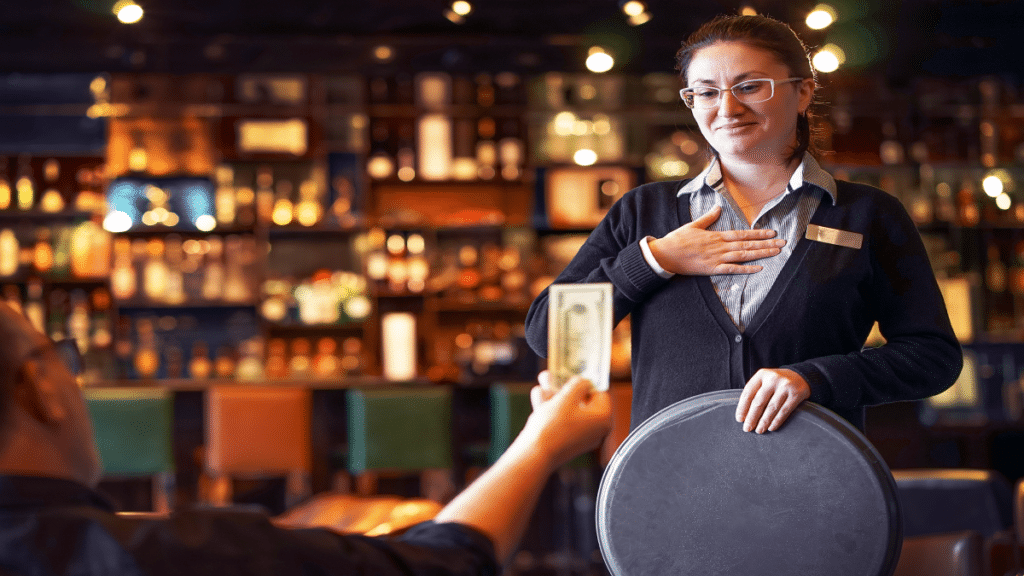 Waitress takes the tip.