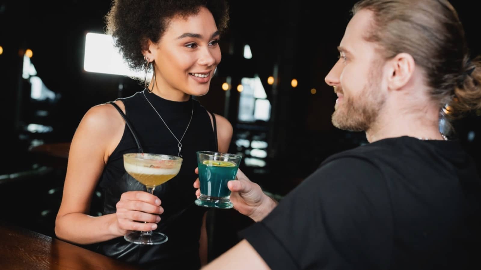 Couples in bar drinking vodka